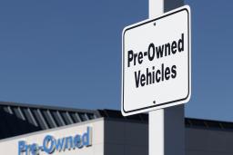 a sign for pre-owned vehicles